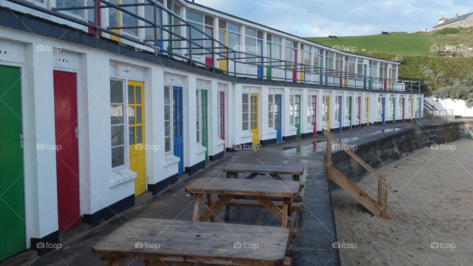 beach huts and picnic benches