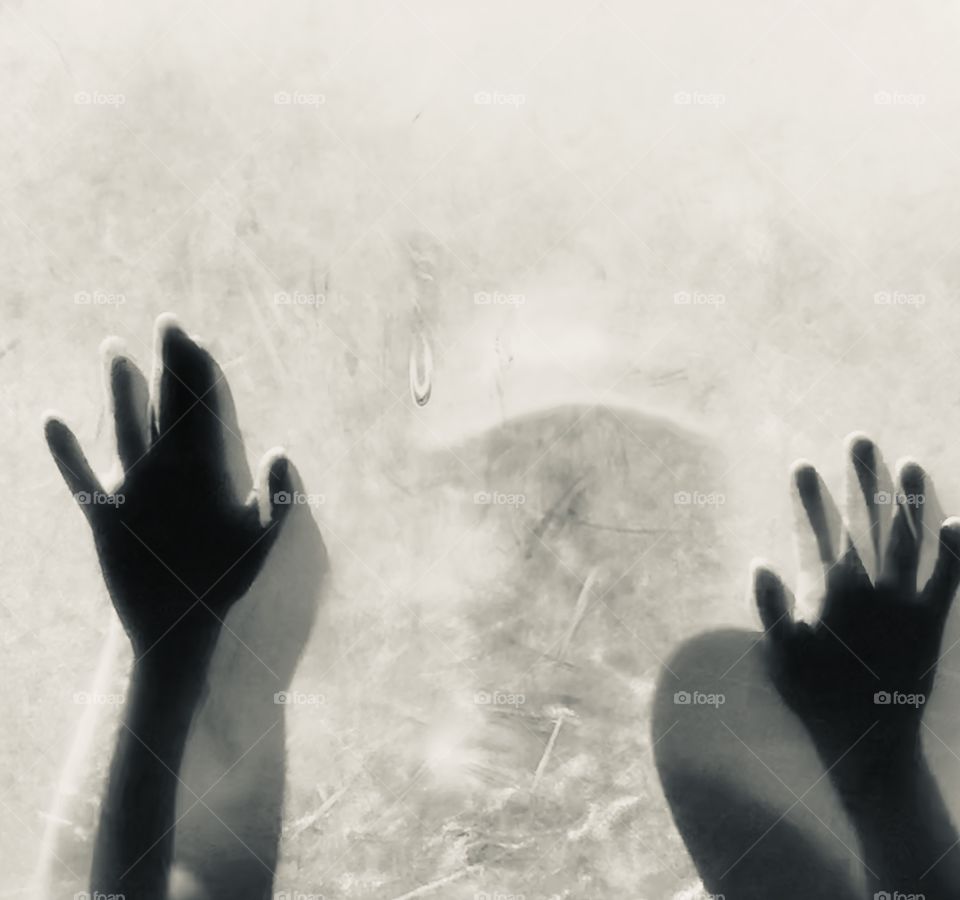 Zombie child hitting window