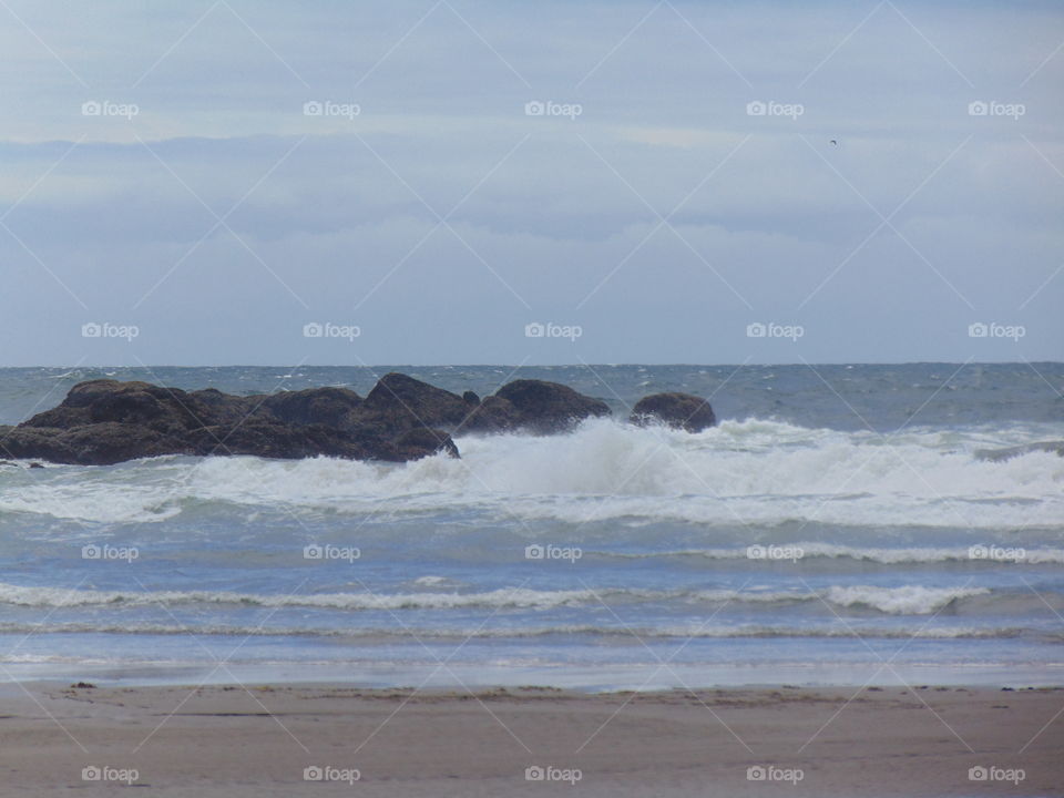 rocks - waves- beautiful short sands beach