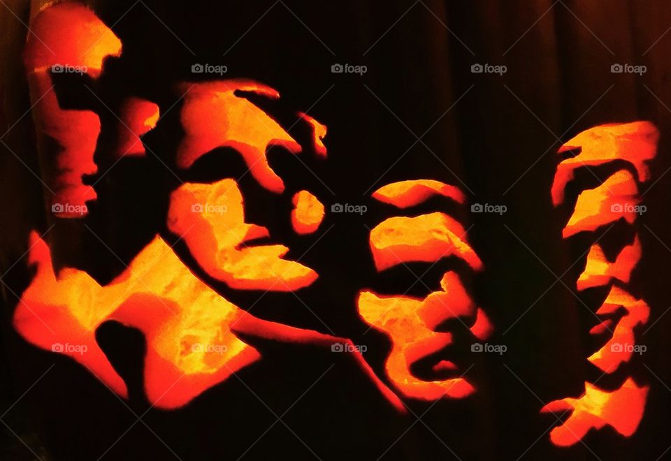 Mount Rushmore on a Halloween pumpkin