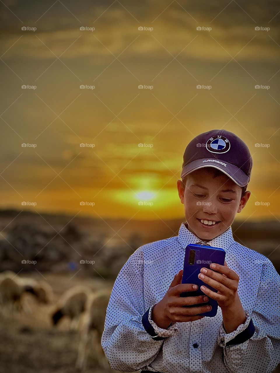 Beautiful child playing on the phone