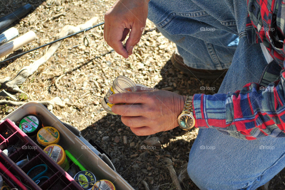 Dipping lure in garlic for fishing