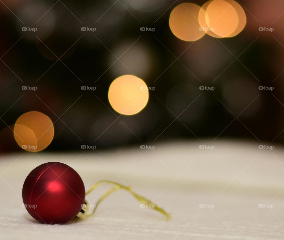 Christmas decorations with lights in the background