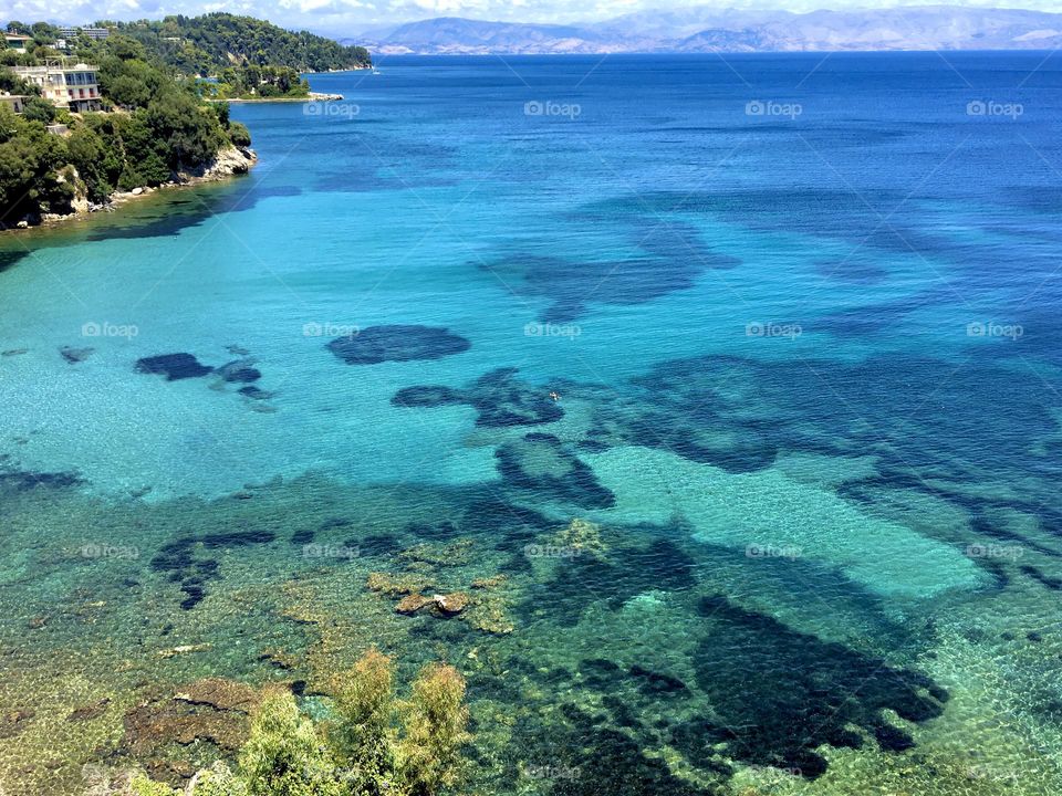 Turquoise and clear water background of the Aegean Sea