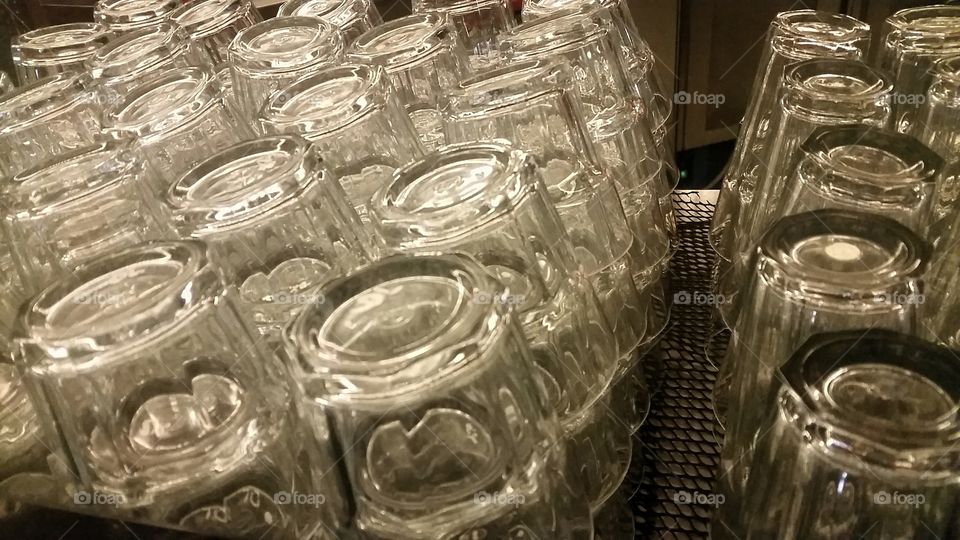 drinking glasses. stacks and rows of drinking glasses