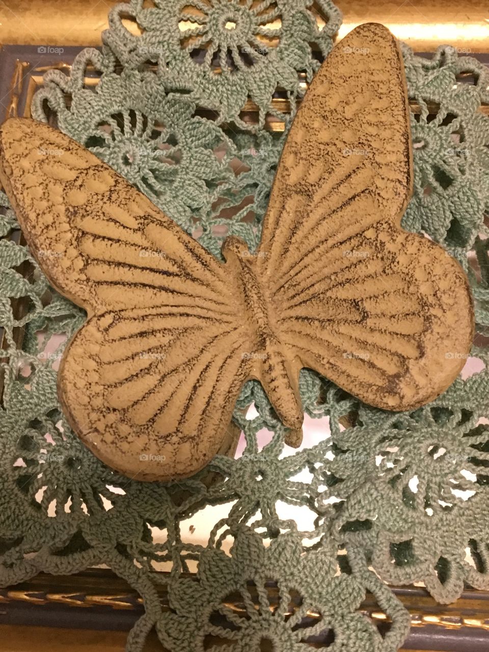 Crocheted Doily and iron cast butterfly 