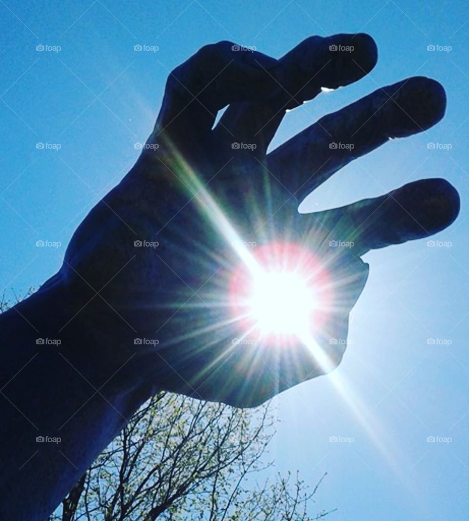 Hand sculpture sun 