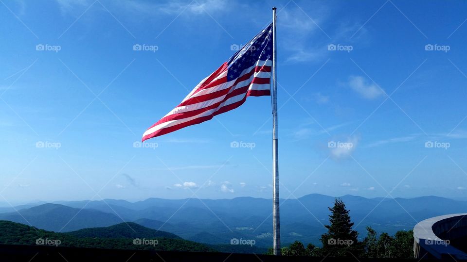 old Glory waving in the breeze high atop Brass town bald in Georgia
