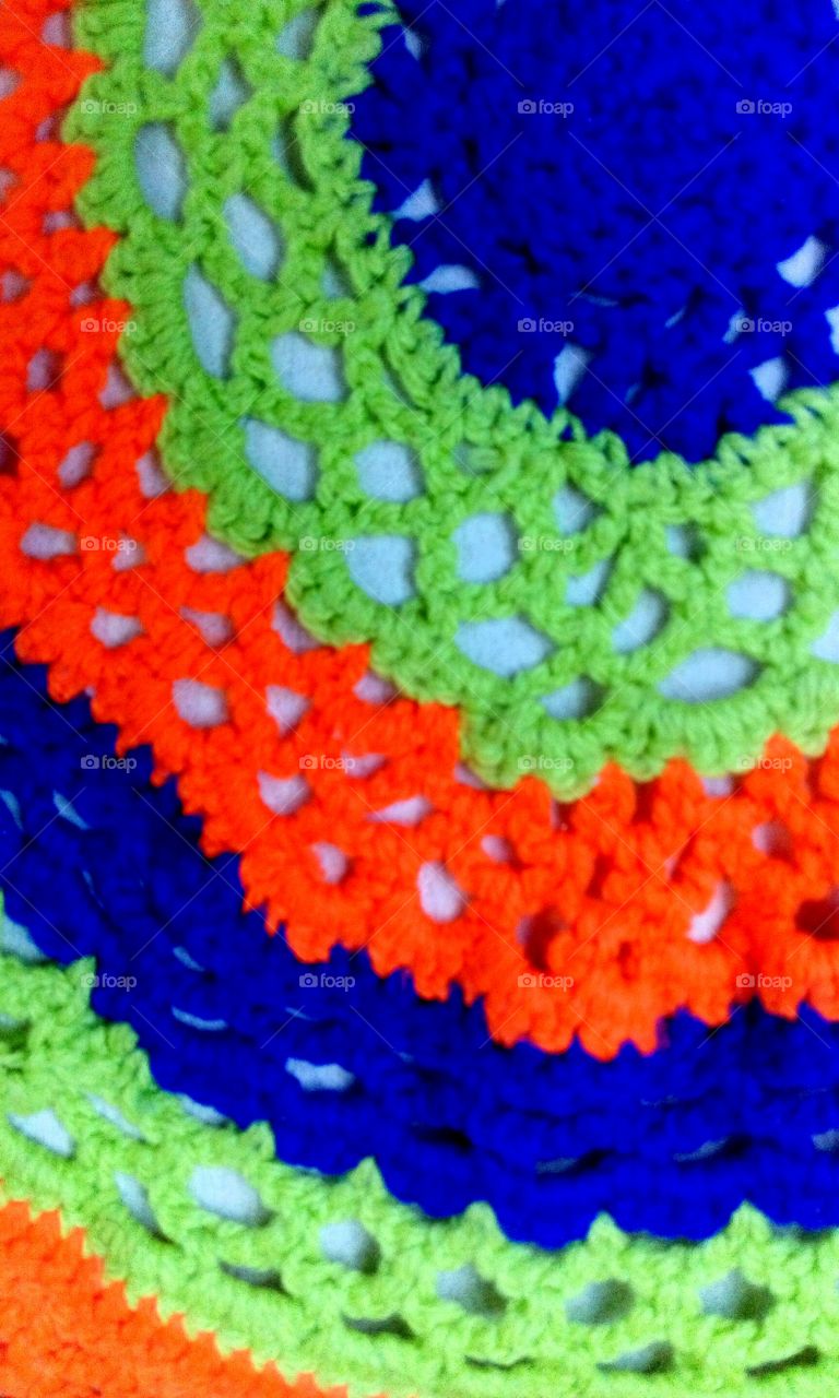 knitting green, orange, dark blue