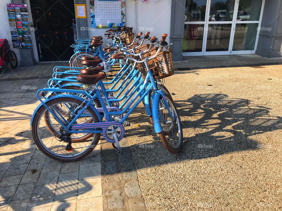 blue bicycles in a square in France