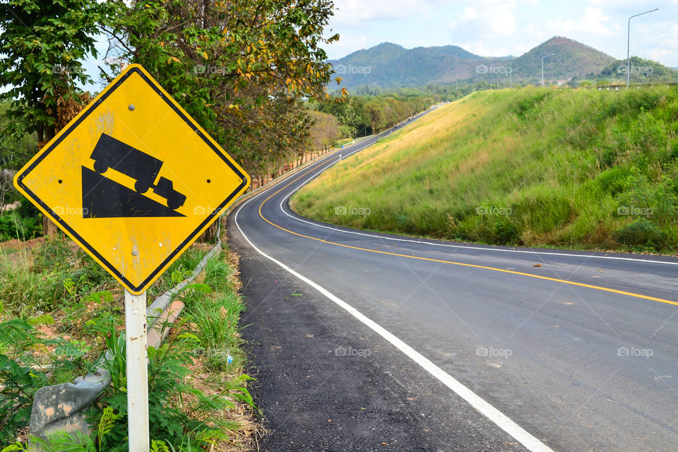 Close up "Steep Hill Descent sign" side a road in the country