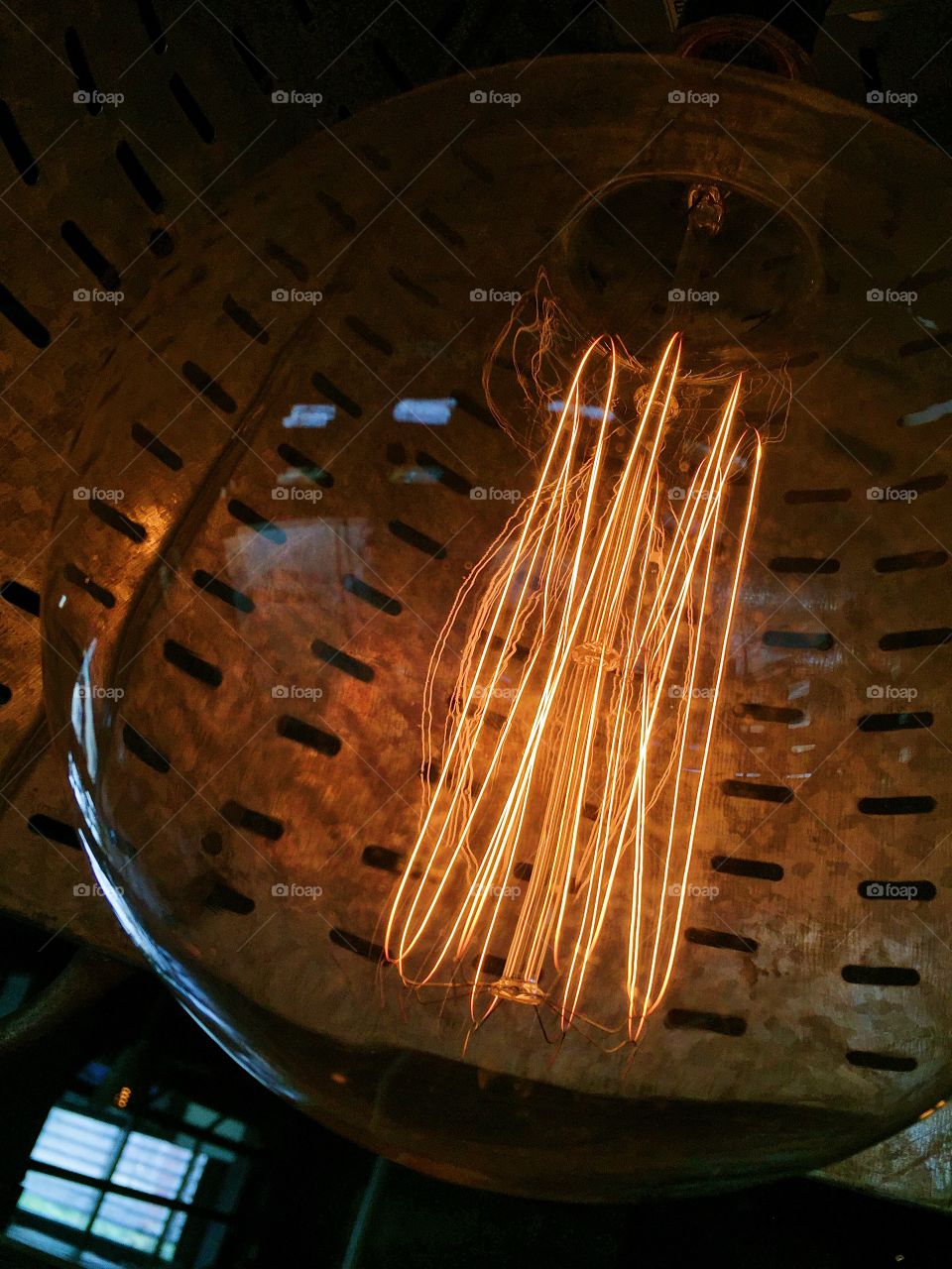 Close up of glowing orange filament in an Edison lightbulb