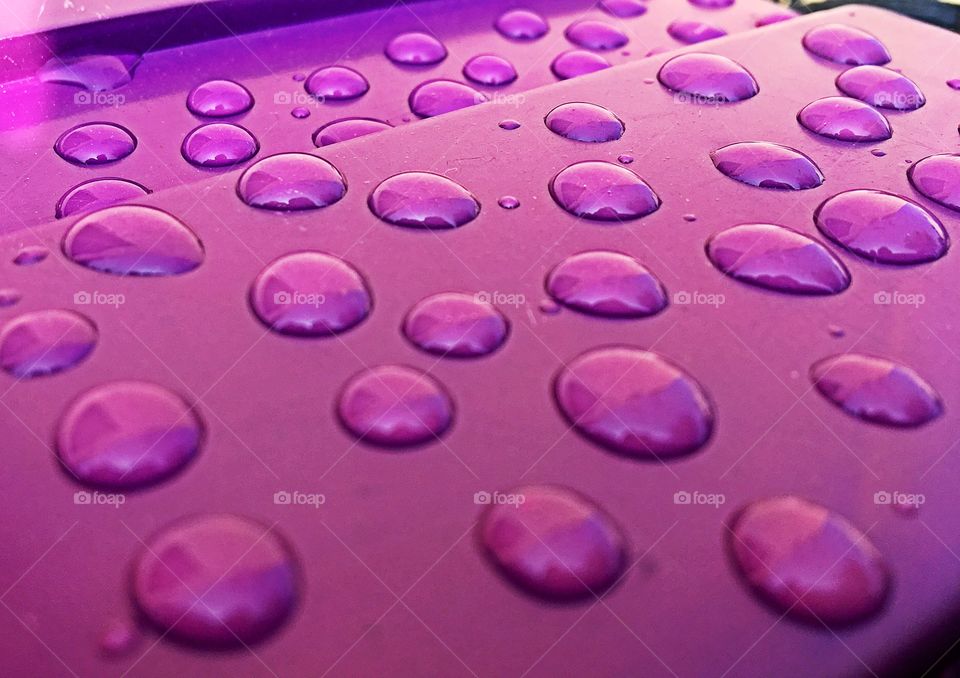 Rain drops on purple background