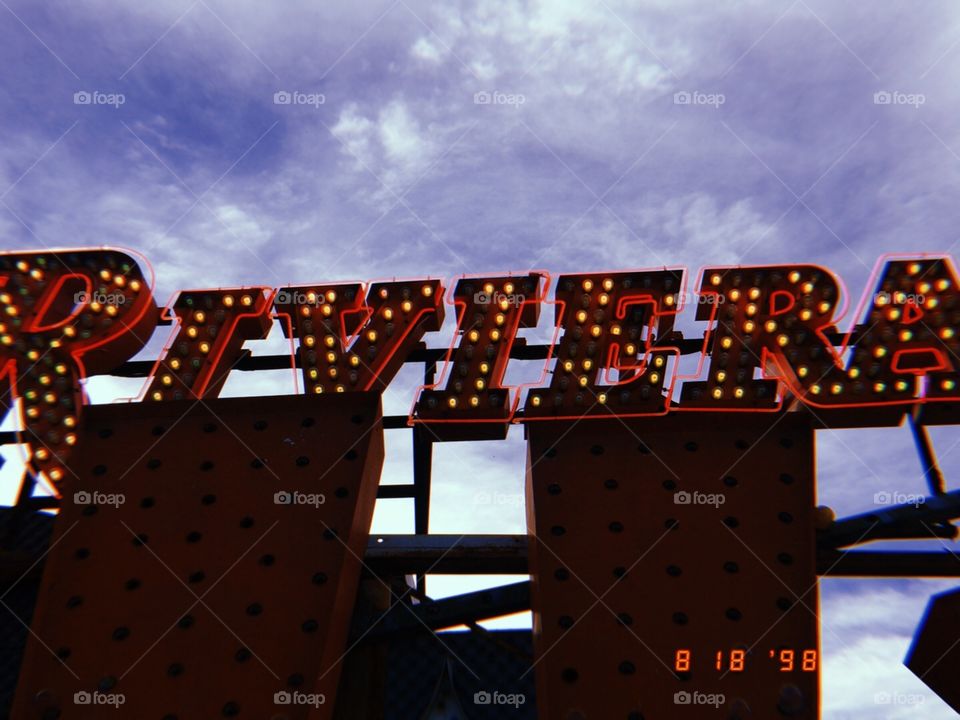 Afternoon skies and neon signs 