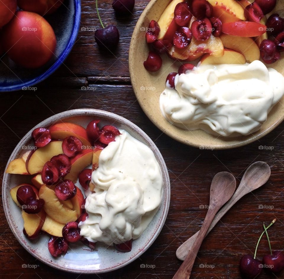 Ice cream with peaches and cherries