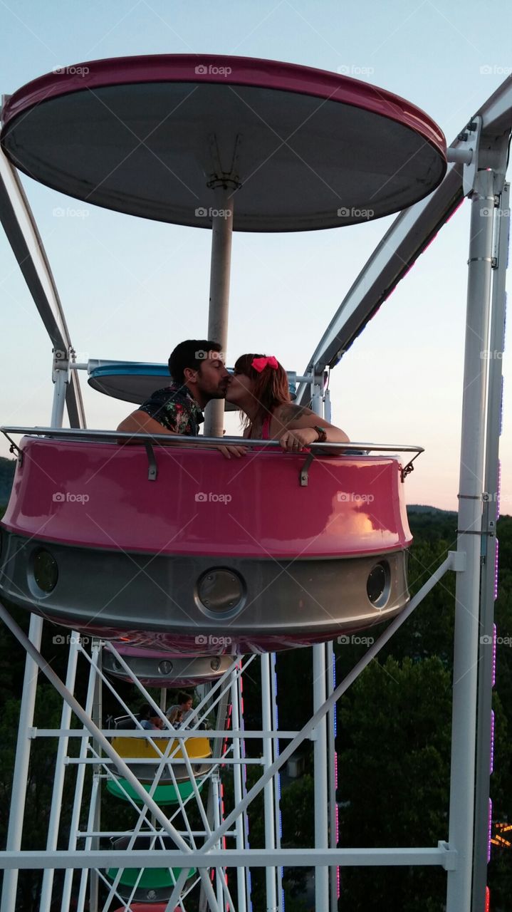 Ferris wheel kisses. kissing on the Ferris wheel
