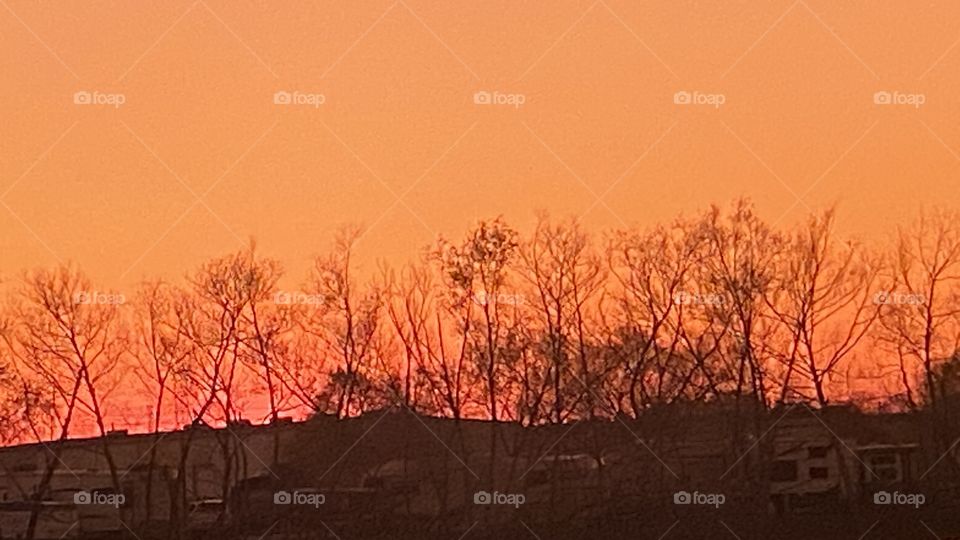 Colors of Sundown shoreline Reflections on Lake Waters. 