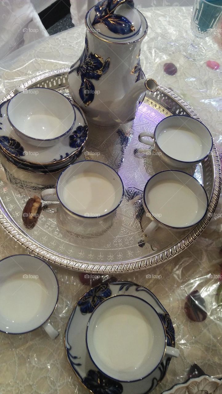 milk and dates to visitors.