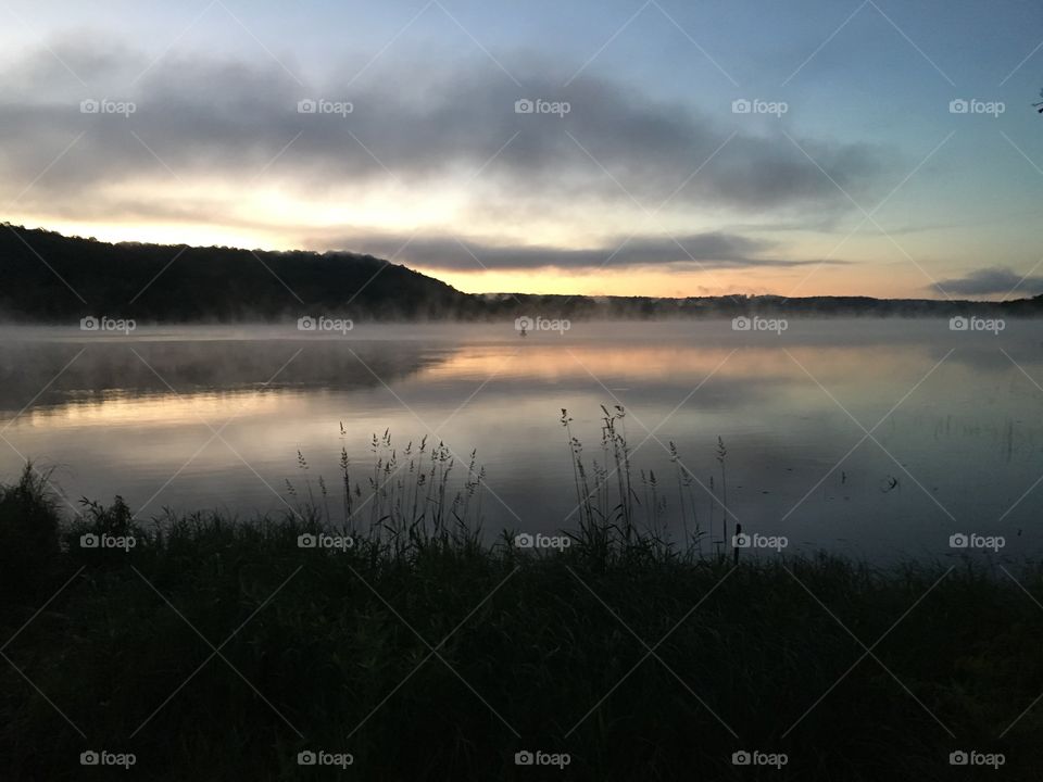 Sunrise and fog on the river