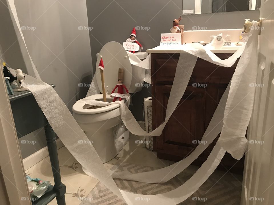 Our mischievous little elves had a potty party in the bathroom - with toilet paper decorations. 