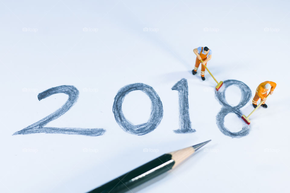 Miniature People erasing 2018 text at the end of year