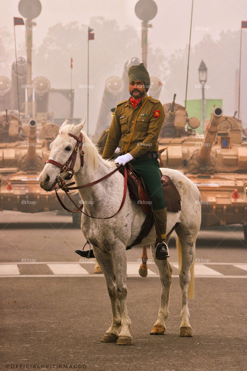 Perfectly tied turban,
Bold eyes,
And
Twirled Moustache
How elevated he looks, while he rides the horse for his duty.