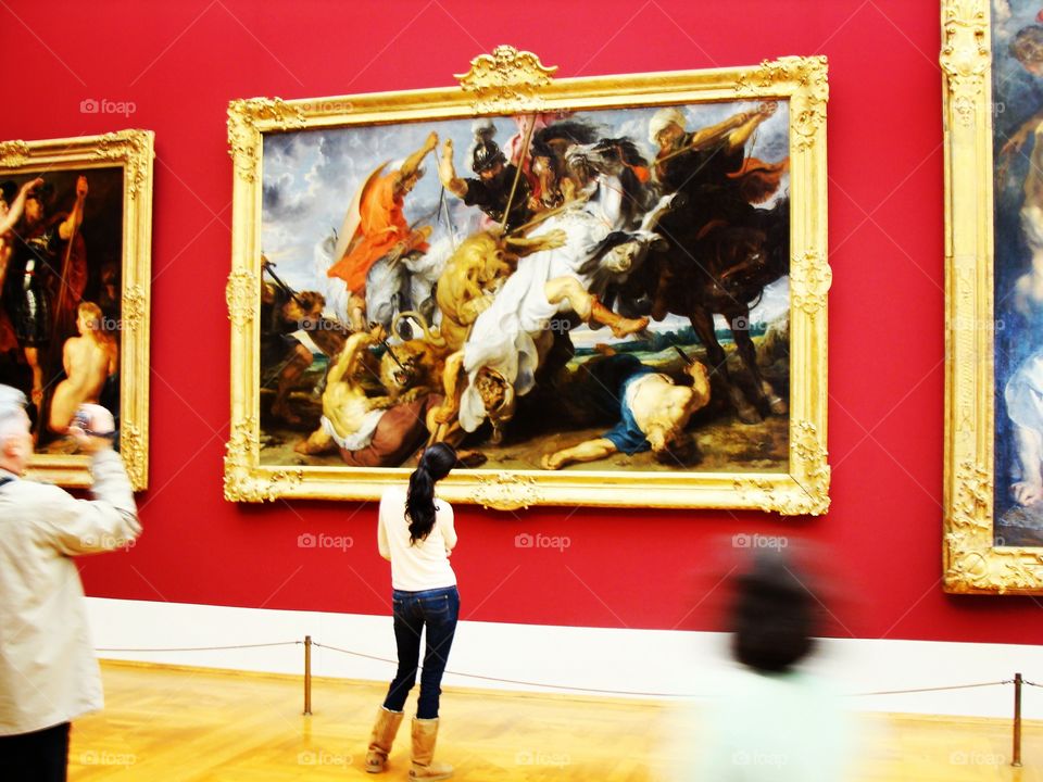 A woman admires a Rubens painting at the Alte Pinakothek in Munich