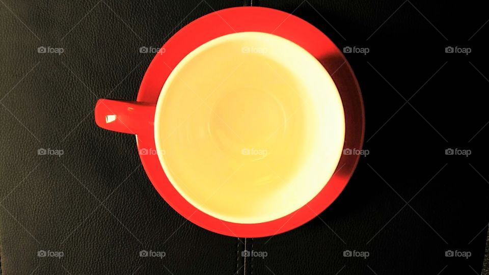 Top view of inside red cup with saucer