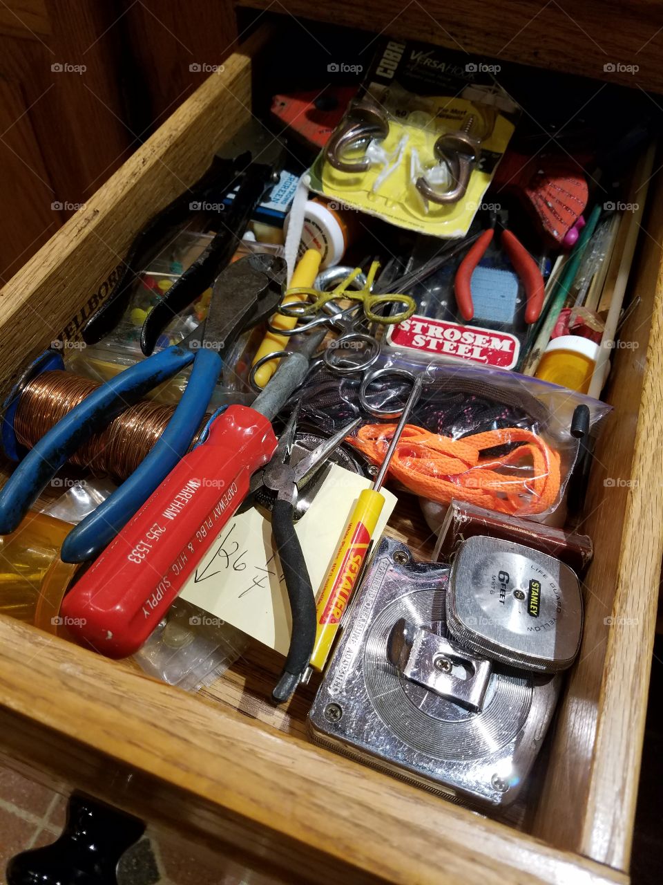 Woman's tool draw in kitchen.