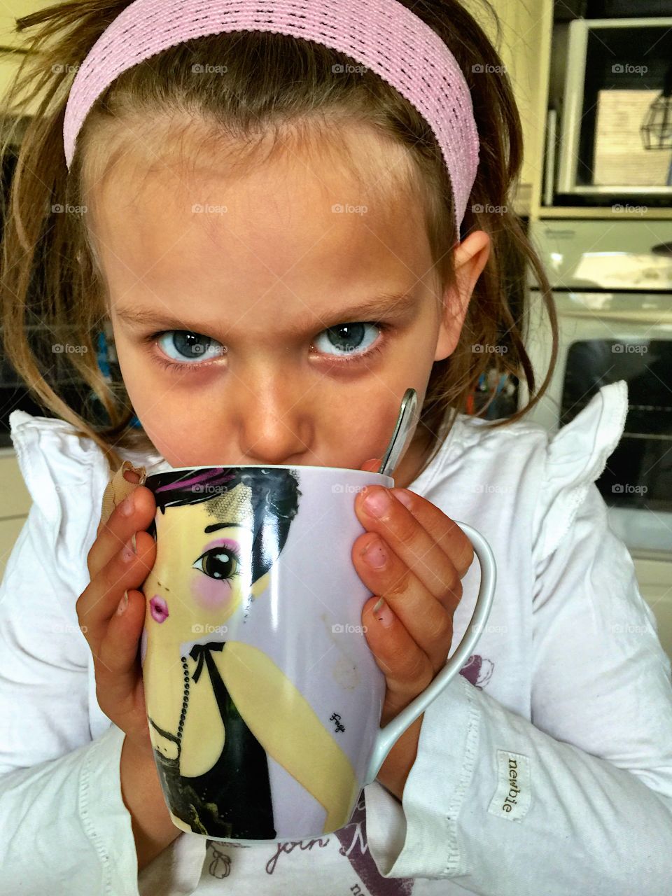 Cute girl drinking coffee