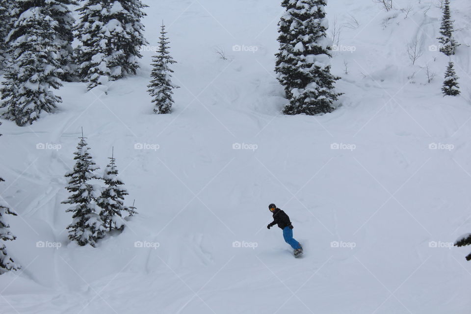 Snowboarder in scenic view