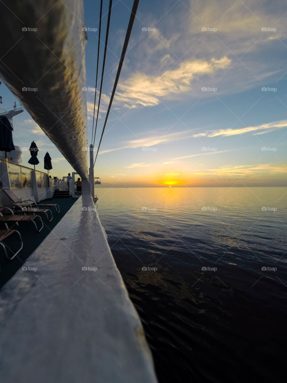 Ona a boat at sunset