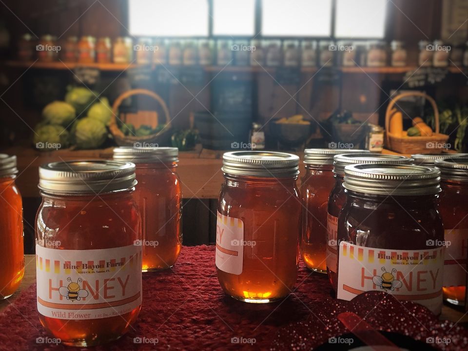 Jars of golden honey at a country market