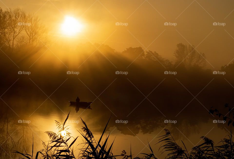 fishing during beautiful autumn sunrise