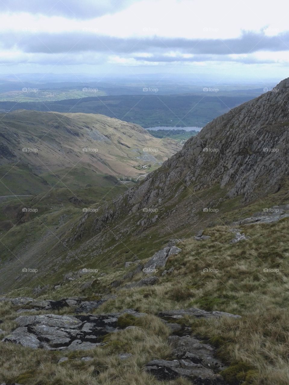 The view from atop the Old Man of Coniston truly is marvellous, the horizon stretching out for miles. The peaceful lake of Coniston Water can be seen in the background, the third largest lake in the Lake District.