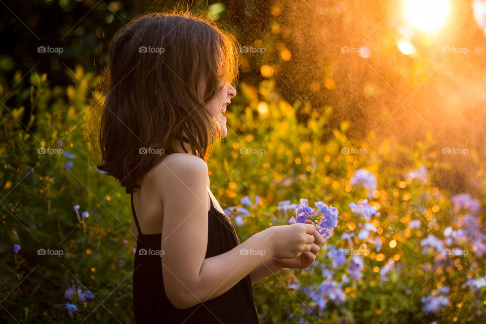 Summer joy! Girl laughing.