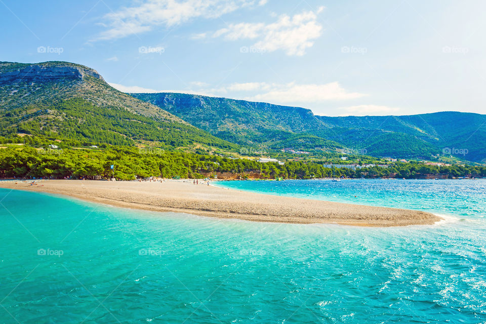 Scenics view of turquoise sea with beach