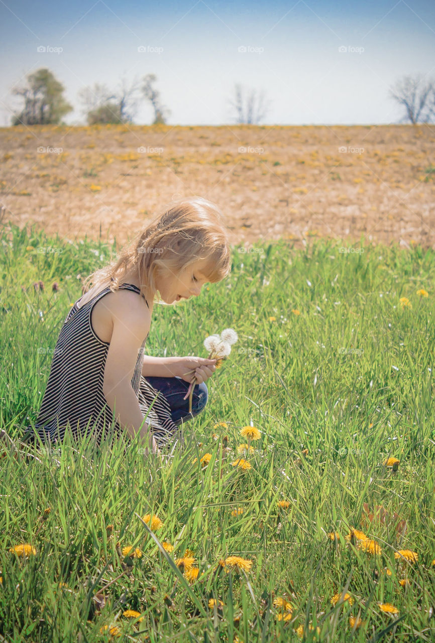 girl picking flowers