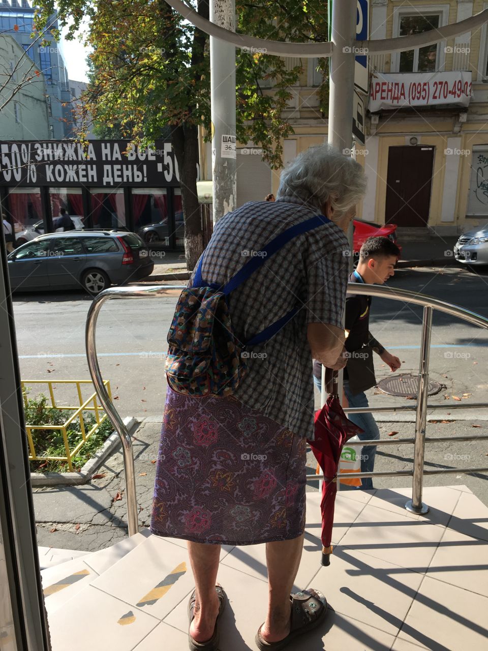 Old woman going out from the apothec