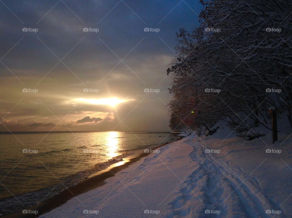 Sunrise at the winter beach 