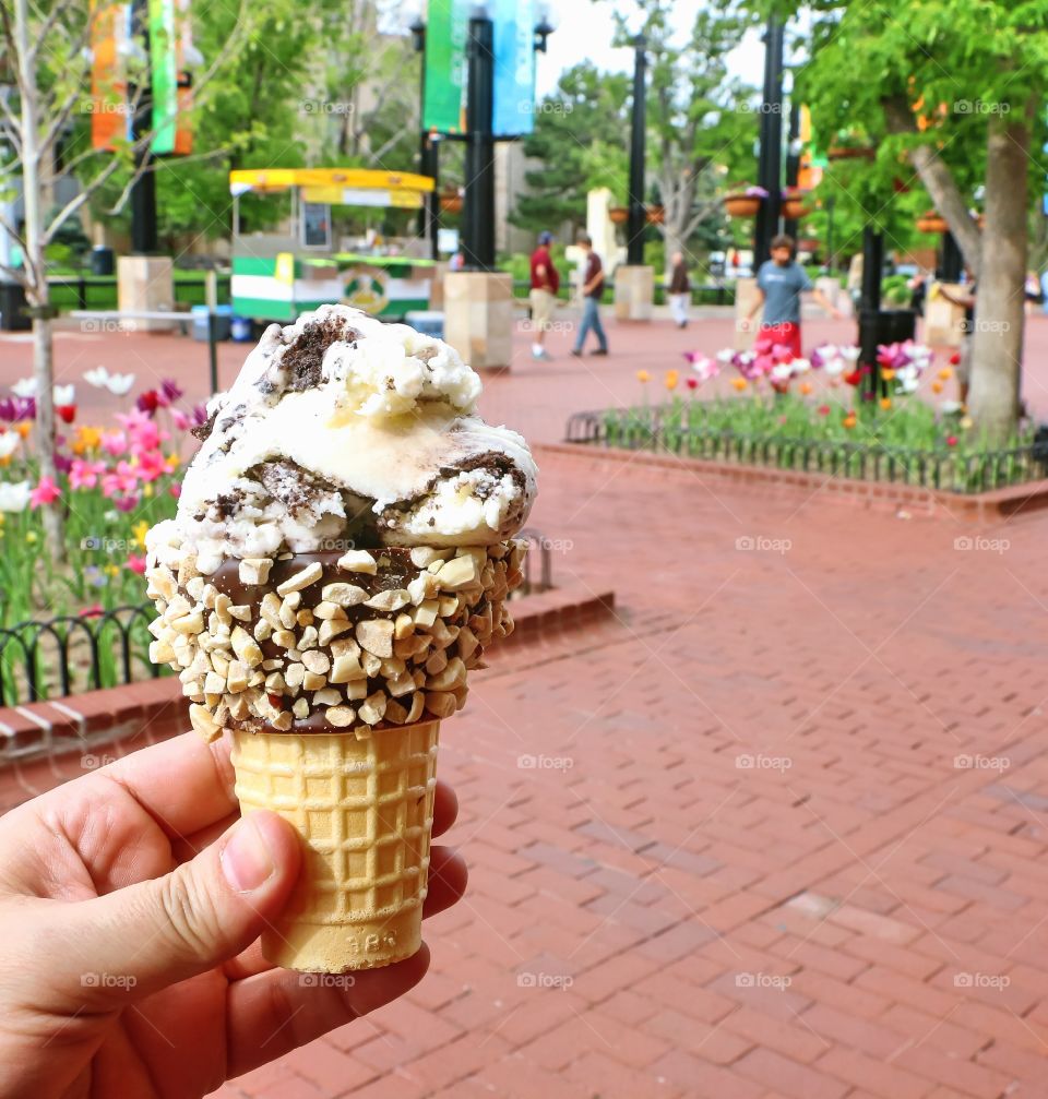 A hand holding an ice cream