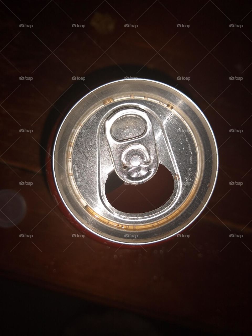 Top of opened orange 🍊 soda 🥤 water can.