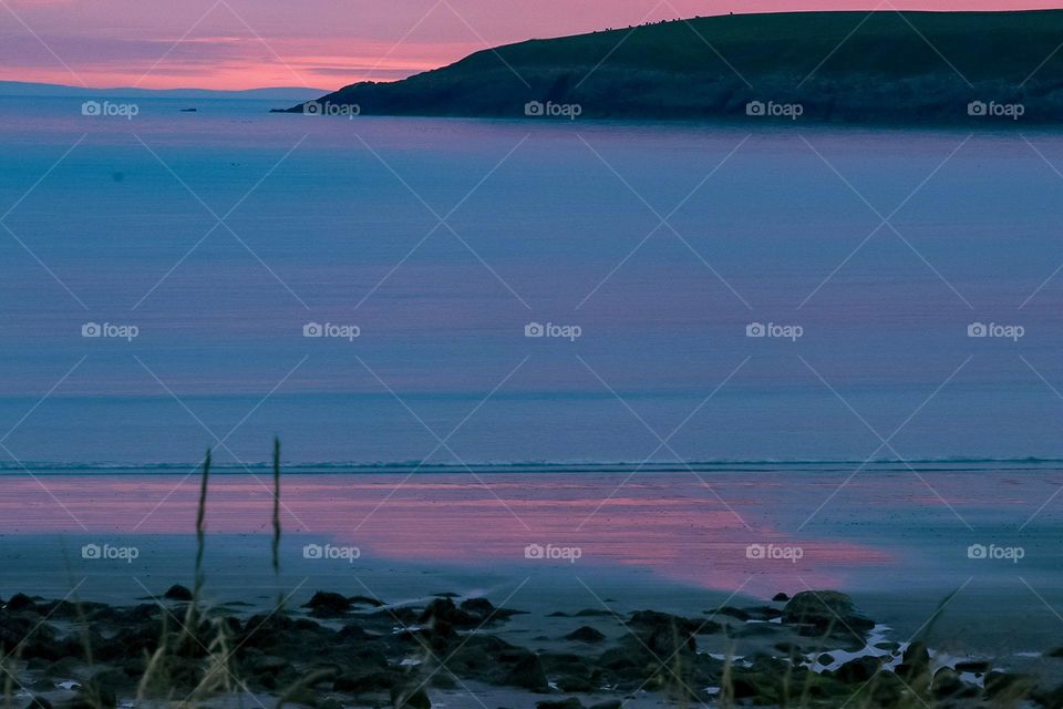 Pink sunset over a bay