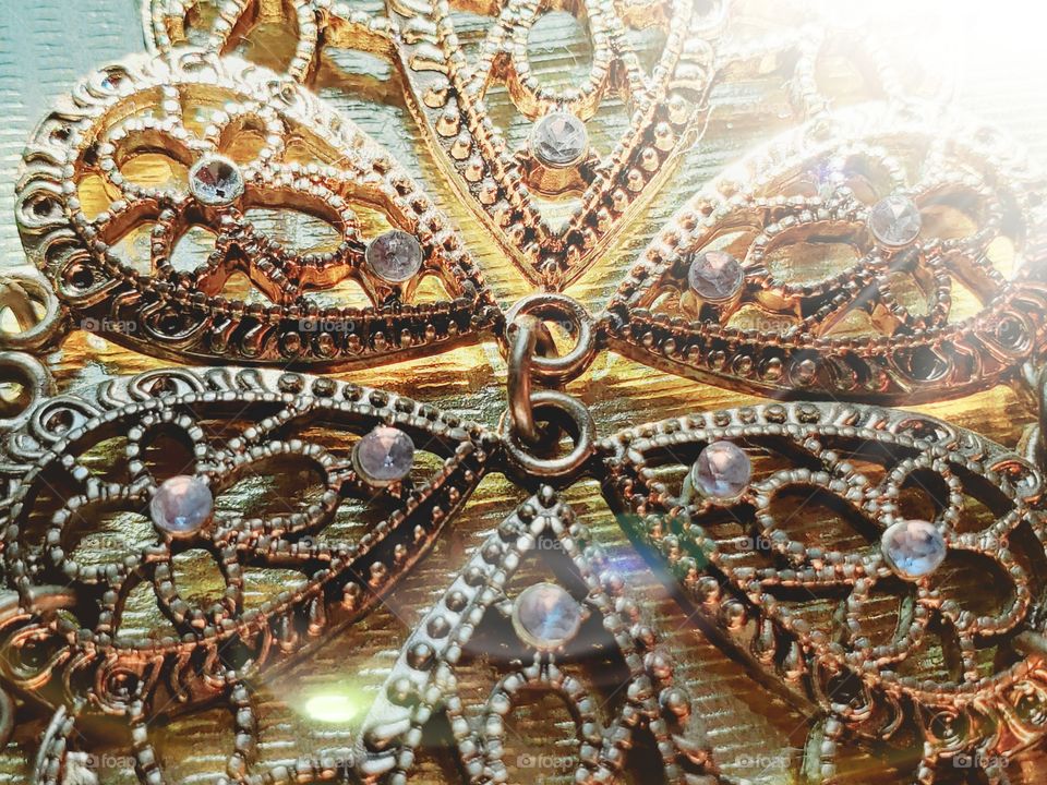 Close up macro shot of earrings with design and stones