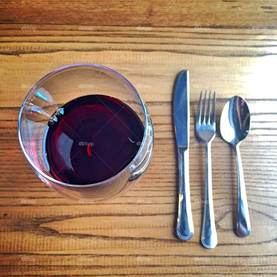 Glass of wine and cutlery