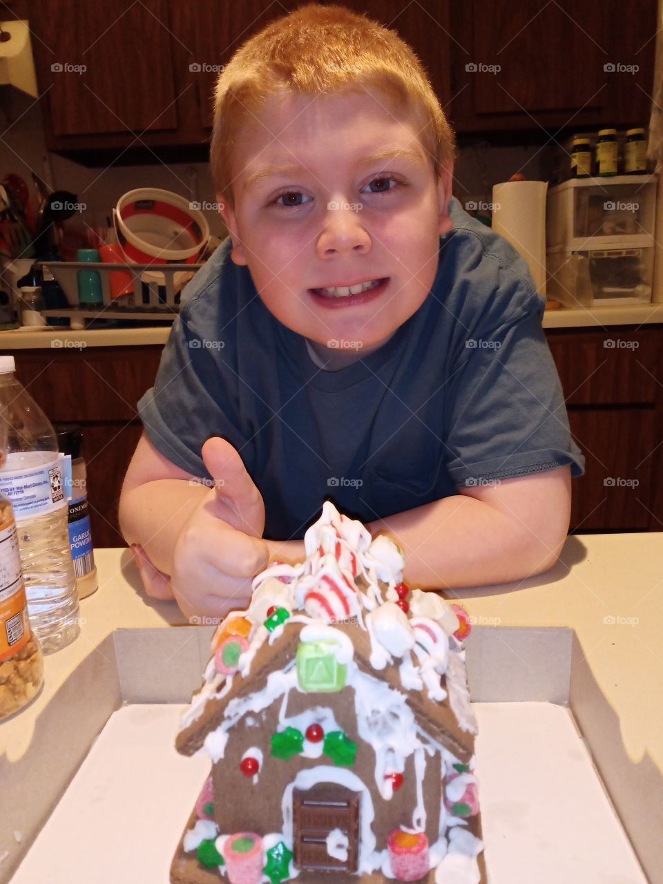 boy made ginger bread house