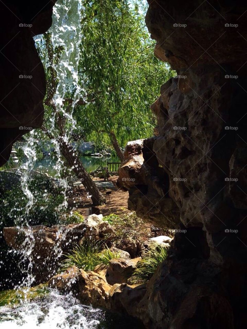 behind the waterfall