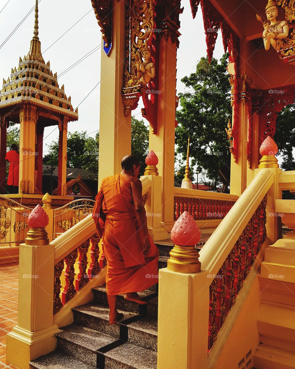 Buddhist monk walking at temple