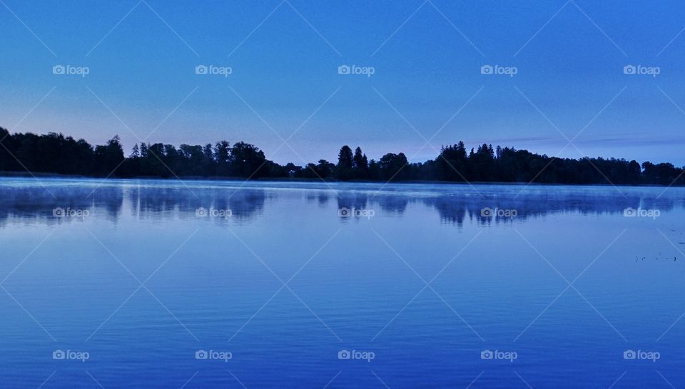 before sunrise at the lakeside in poland