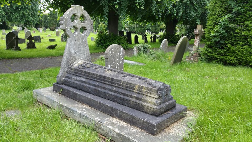 100 + years old graves
Some people think graveyard and cemetery mean the same, but, if we want to be a little nitpicky, we should say that graveyard is a type of cemetery, but a cemetery is usually not a graveyard. To understand the difference, we need a little bit of history.
From about the 7th century, the process of burial was firmly in the hands of the Church (meaning the organization), and burying the dead was only allowed on the lands near a church (now referring to the building), the so-called churchyard. The part of the churchyard used for burial is called graveyard, an example of which you can see in the picture.
As the population of Europe started to grow, the capacity of graveyards was no longer sufficient (the population of modern Europe is almost 40 times higher than it was in the 7th century). By the end of the 18th century, the unsustainability of church burials became apparent, and completely new places, independent of graveyards, were devised—and these were called cemeteries.
The etymology of the two words is also quite intriguing. The origin of "graveyard" is rather obvious; it is a yard filled with graves. However, you might be surprised to hear that "grave" comes from Proto-Germanic *graban, meaning "to dig", and is unrelated to "gravel".
Of course, the word "cemetery" did not appear out of the blue when graveyards started to burst at the seams. It comes from Old French cimetiere, which meant, well, graveyard. Nevertheless, the French word originally comes from Greek koimeterion, meaning "a sleeping place". Isn't that poetic?